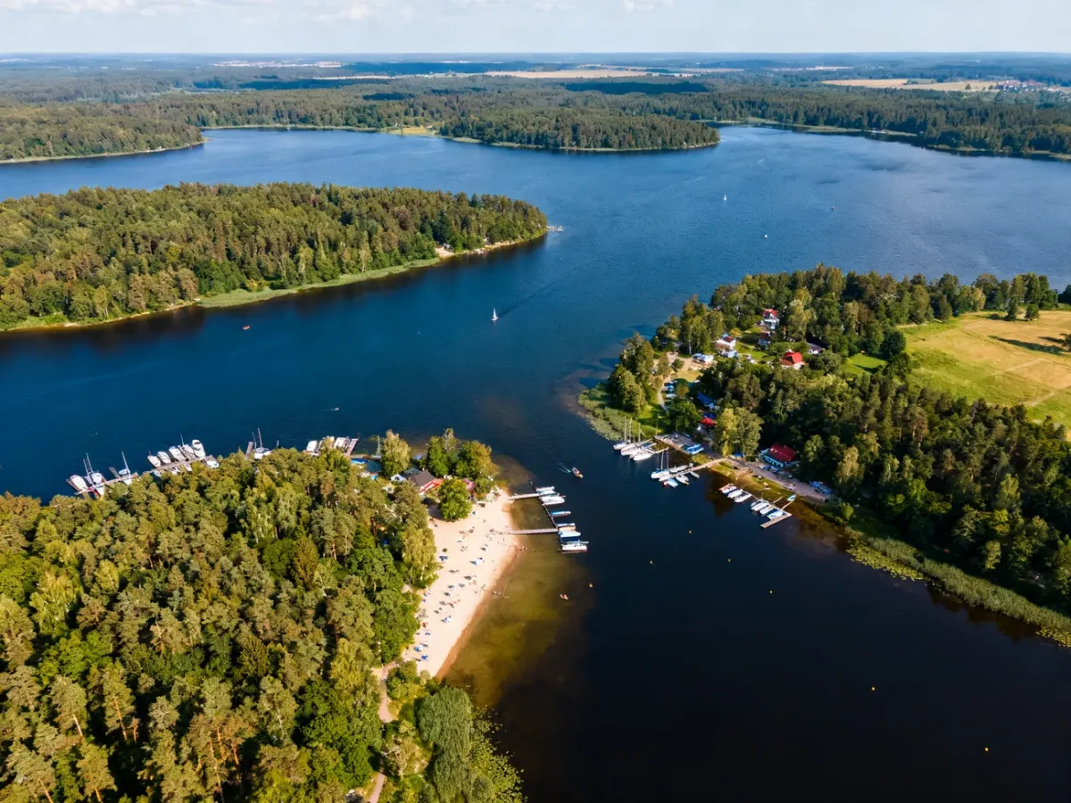 Aerial view of Masurian lakes with forests, beaches and marinas